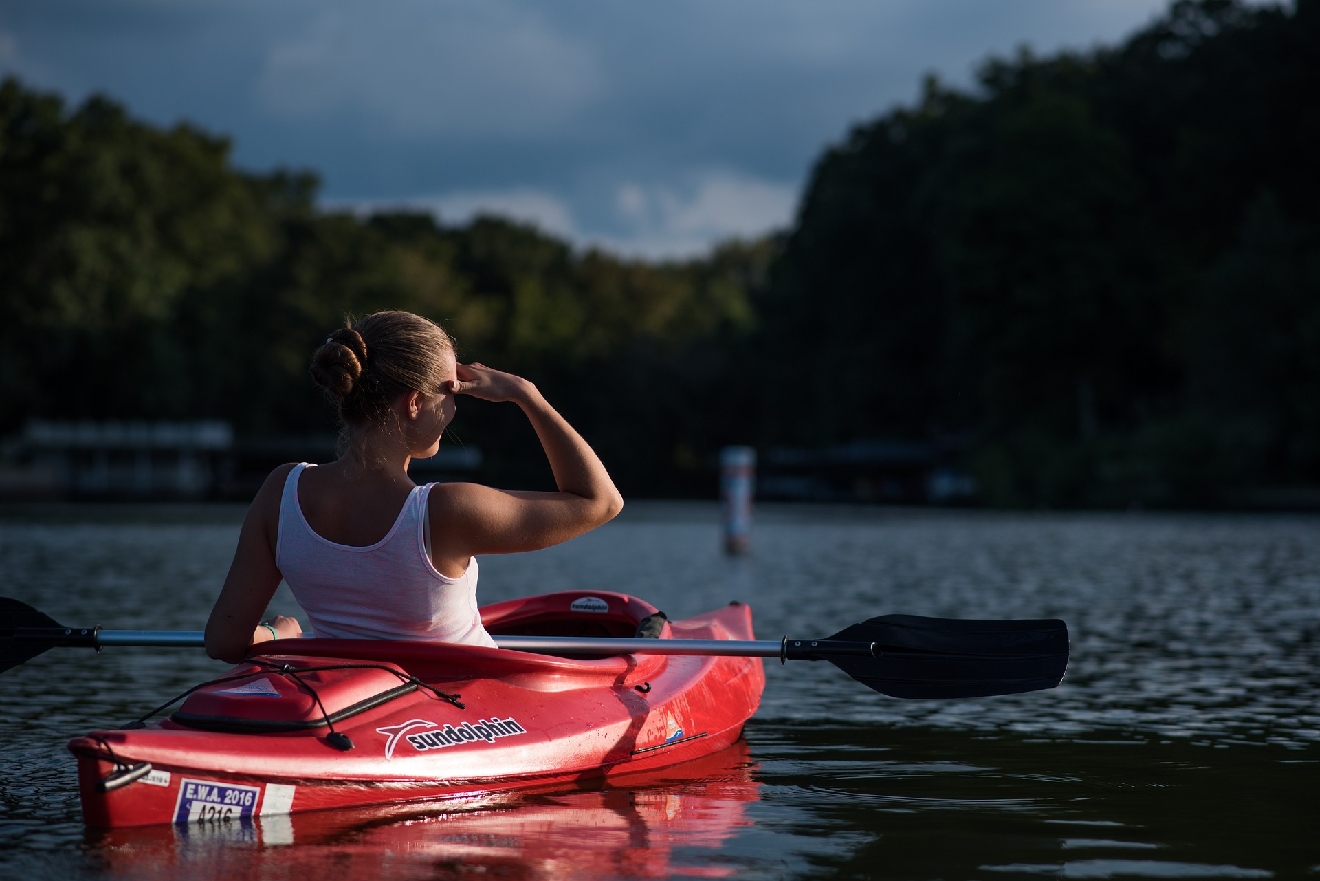 Woman in a kayak on a lake