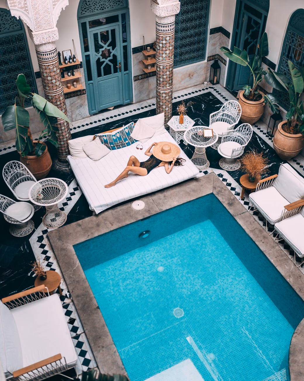 photo of person near swimming pool